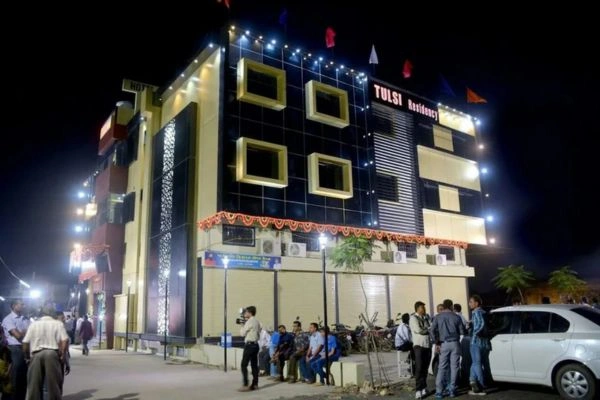 Hotel exterior at night with illuminated facade
