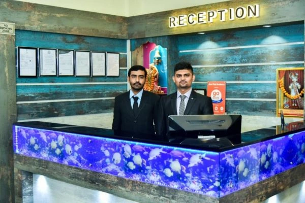 Hotel reception desk with staff